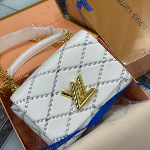 LOUISS VUITTONN GRAND TWISTER HANDBAG CUM SLING