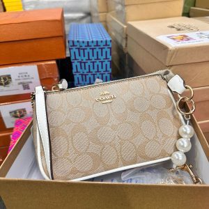 COACHH LATEST EDITION SLING