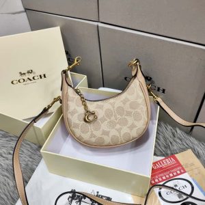 COACHH MINI JONIE BAG IN SIGNATURE CANVAS